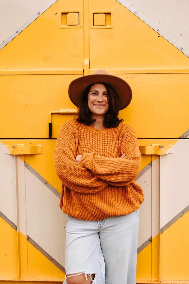 yellow trailer with girl in front